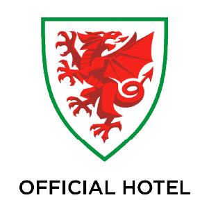 Red dragon on a white shield with green border above the text 